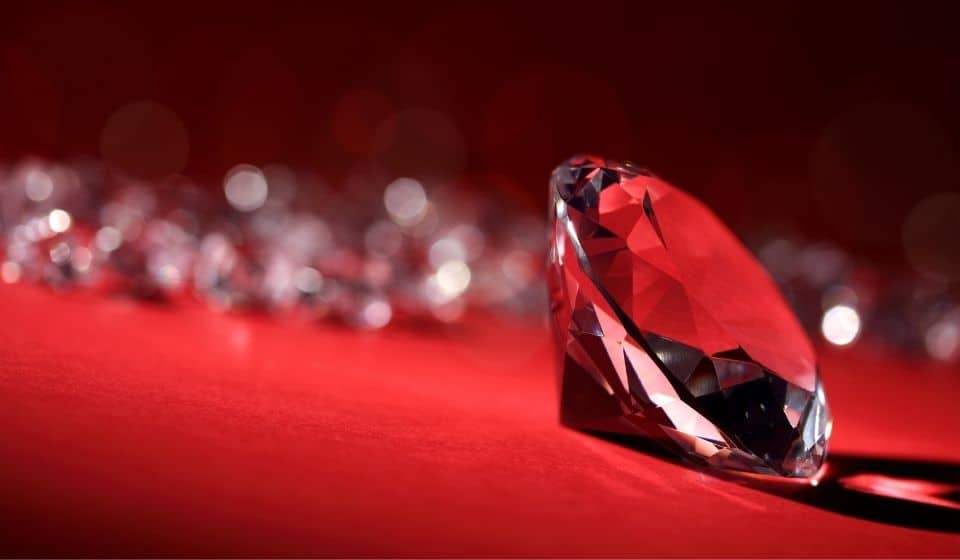 Diamond gem on a red background