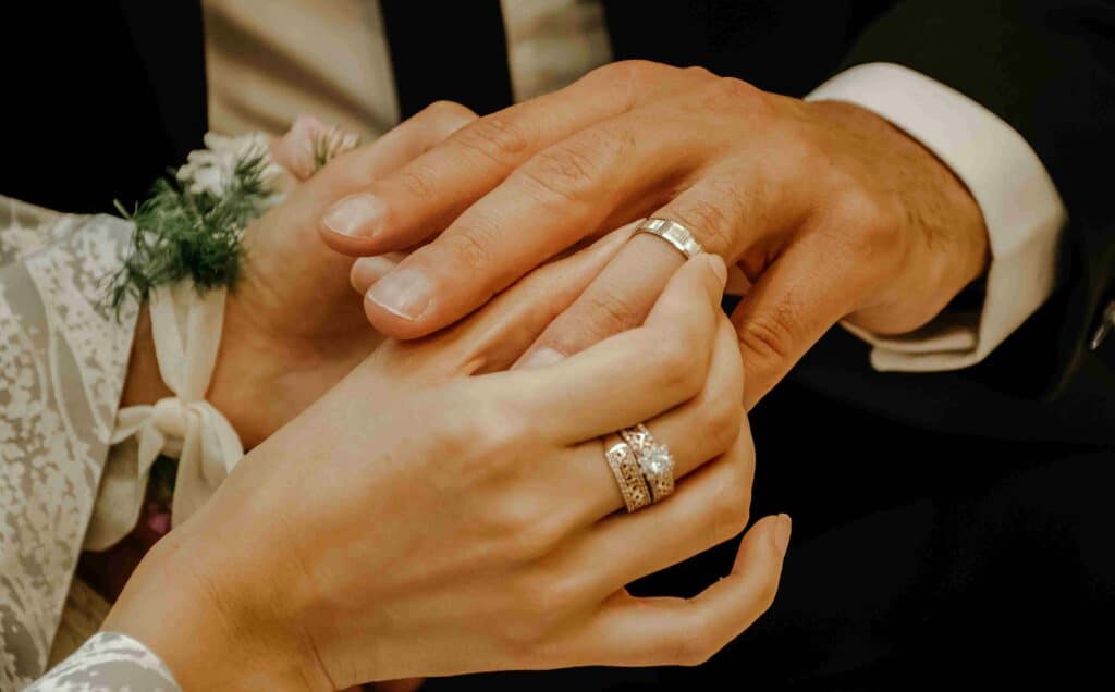 couple exchanging wedding rings