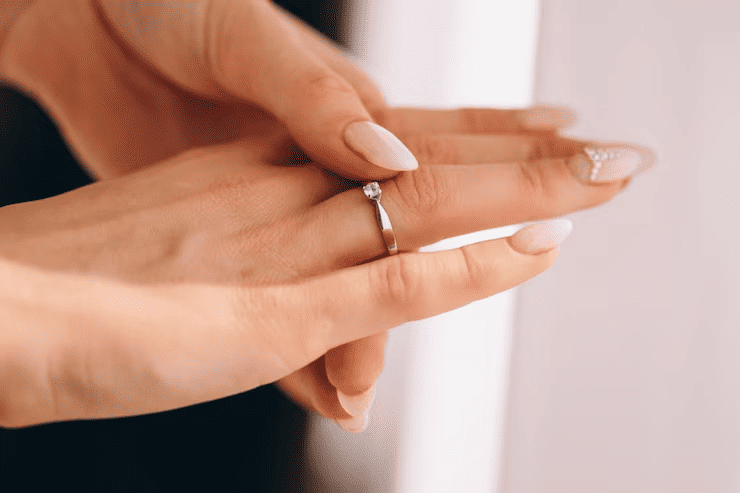a promise ring on a women's hand